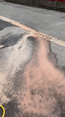 Pink liquid spills across street in Saint-Ouen-sur-Seine