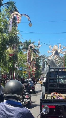 Morning traffic flows through decorated streets in Gianyar, Indonesia