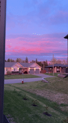 Vibrant sunset colors illuminate residential Dieppe neighborhood