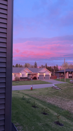 Vibrant sunset colors illuminate residential Dieppe neighborhood