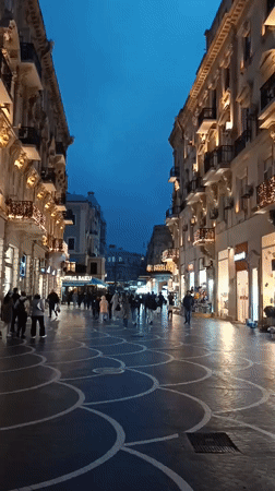 Evening pedestrian activity captured on Baku city streets