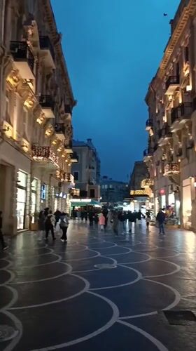 Evening pedestrian activity captured on Baku city streets