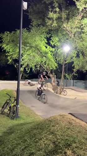 Night riding at an Almaty bike park with jumps and fresh paths