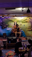 Acoustic musician performs at festival gathering in Haini, India