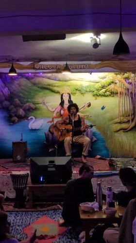 Acoustic musician performs at festival gathering in Haini, India