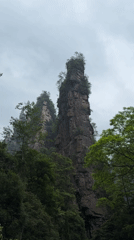 Visitor documents scenic rock formations and streams in Luoguta