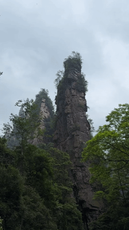 Visitor documents scenic rock formations and streams in Luoguta