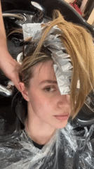 Woman gets blonde highlights at Tbilisi salon