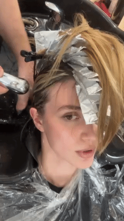 Woman gets blonde highlights at Tbilisi salon