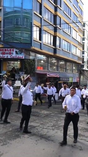 Musical group parades through La Paz streets