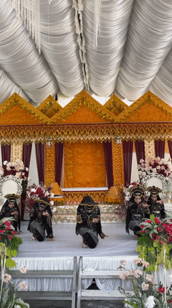 Traditional dance performance on a decorated stage in Kulam Baro