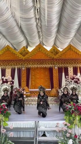 Traditional dance performance on a decorated stage in Kulam Baro