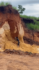 Manual quarry digging at a layered soil embankment in Ufu Esioni