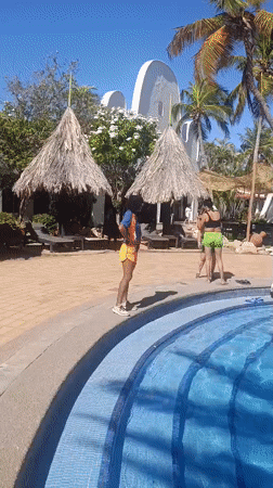 Resort guests enjoy sunny afternoon at Porlamar pool area