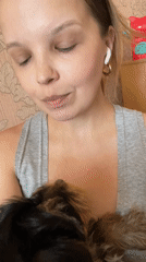 Cozy indoor selfies with a small black and tan puppy