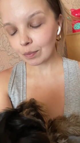 Cozy indoor selfies with a small black and tan puppy