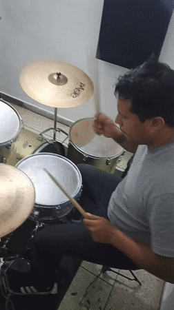 Drummer practices late night session in Tinaquillo studio