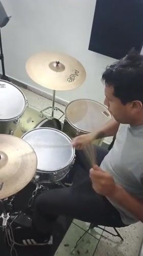 Drummer practices late night session in Tinaquillo studio