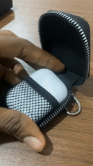 Earbuds and a landline phone, side by side in Dutsen Alhaji