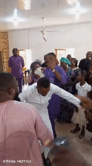 Community celebration with dancing held at Nigerian church hall