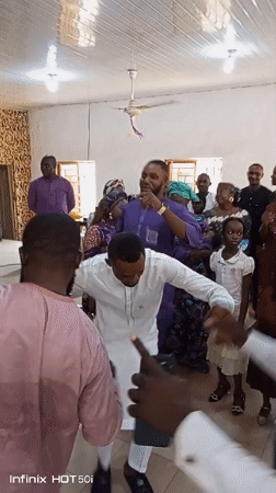 Community celebration with dancing held at Nigerian church hall