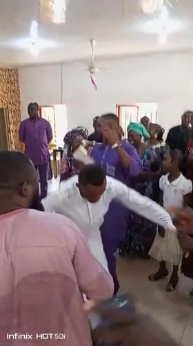 Community celebration with dancing held at Nigerian church hall