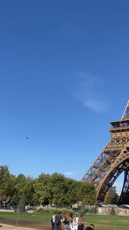 Eiffel Tower ironwork up close on a clear Paris morning