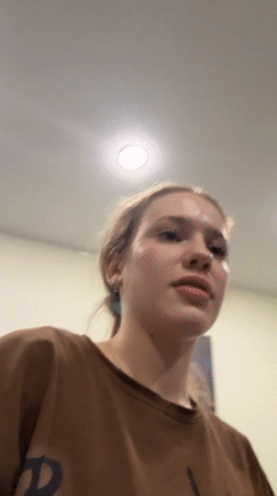 Young woman's evening activities captured in Russian home