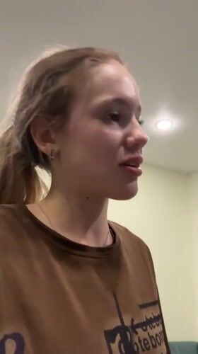 Young woman's evening activities captured in Russian home