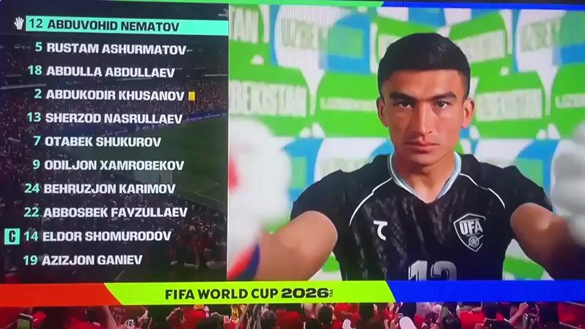 This media file shows a screen displaying player information for a football match, with the text "FIFA WORLD CUP 2026" at the bottom. On the left, a list of players is shown with their jersey numbers and names, predominantly in Uzbek. The highlighted players are:

*   12 ABDU VOHID NEMATOV
*   5 RUSTAM ASHURMATOV
*   18 ABDULLA ABDULLAEV
*   2 ABDUKODIR KHUSANOV
*   13 SHERZOD NASRULLAEV
*   7 OTABEK SHUKUROV
*   9 ODILJON XAMROBEKOV
*   24 BEHRUZZHON KARIMOV
*   22 ABBO SBEK FAYZULLAEV
*   C 14 ELDOR SHOMURODOV
*   19 AZIZJON GANIEV

On the right side of the screen, individual portraits of players are shown. The background features a green and white checkered pattern with the word "UZBEKISTAN" repeated. The player portraits appear to be from a football team, possibly the Uzbekistan national team, given the prominent display of the country's name. The lighting suggests an indoor setting, likely a stadium or broadcast studio. The overall atmosphere appears to be professional and focused on the football event. The FIFA World Cup 2026 branding indicates the context of the broadcast. The presence of a crowd in the lower part of the image suggests a live event.