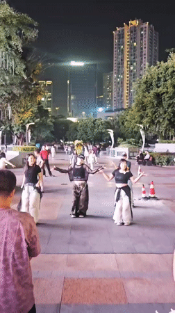 Street performers dance and cosplay in Liangjiang public spaces