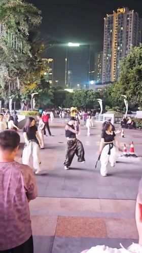 Street performers dance and cosplay in Liangjiang public spaces