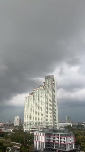 Morning observations of overcast Pattaya cityscape and mango breakfast