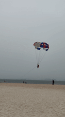 Beach gathering in Bai Chay Ward on overcast morning