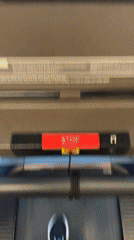 Person exercises on treadmill at gym facility