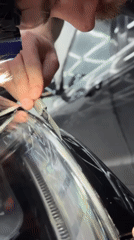Auto shop workers modify vehicles in Krasnoyarsk garage