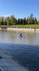 Kayakers launch from Yenisey River embankment in Krasnoyarsk