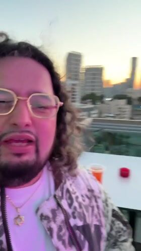 Man Films Selfie Video on Ramat Gan Rooftop at Sunset
