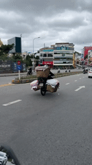 Motorcycle with cloth baskets spotted on Da Lat street