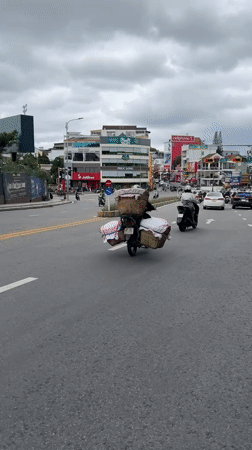 Motorcycle with cloth baskets spotted on Da Lat street