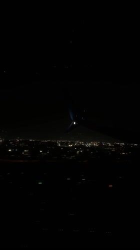 Nighttime aerial view of Miami captured from airplane window