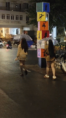 Da Lat streets after rain, shops and spas open for the night