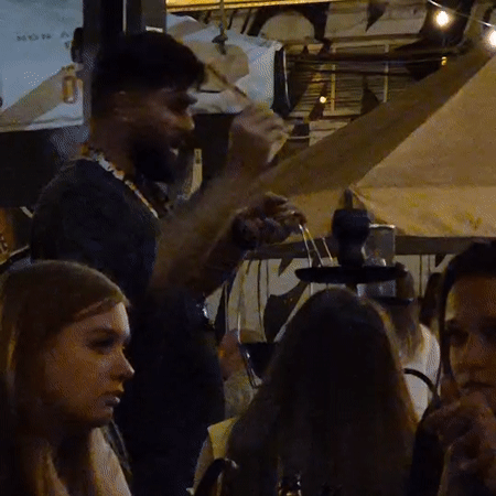 Nighttime social gathering documented at outdoor Kemerovo venue