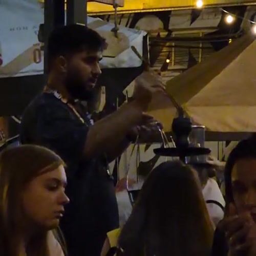 Nighttime social gathering documented at outdoor Kemerovo venue