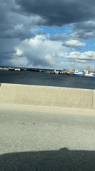 Industrial harbor activity observed from roadway in Chaikovsky, Russia