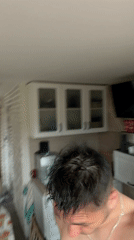 Man takes multiple selfies in kitchen in Bulgaria