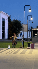Evening street life and fountain gathering in Izhevsk square