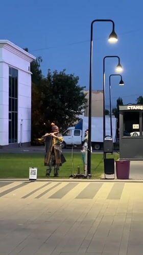 Evening street life and fountain gathering in Izhevsk square