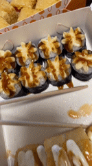 Woman with sushi takeout documented during afternoon outing