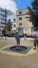 Child plays on trampoline at Barcelona park